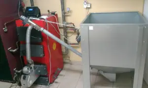 System do ogrzewania, pokazujący jak przerobić piec na ekogroszek na pellet, z podajnikiem i zasobnikiem.